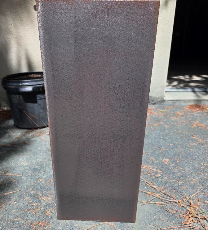 Plaque acier — surface remise à nu — après